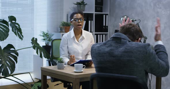 Young Man Talking To Psychologist