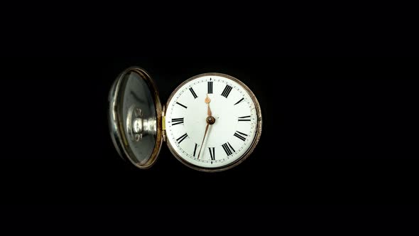 Vintage Pocket Watch Rotate Arrows Go. Black Background. Time Lapse