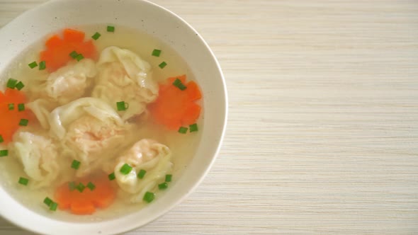 shrimp dumpling soup in white bowl - Asian food style