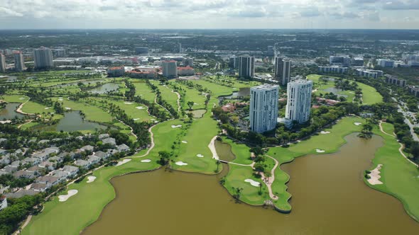 Aerial View on the Miami Suburban Area with the Private Golf Course and Lake 