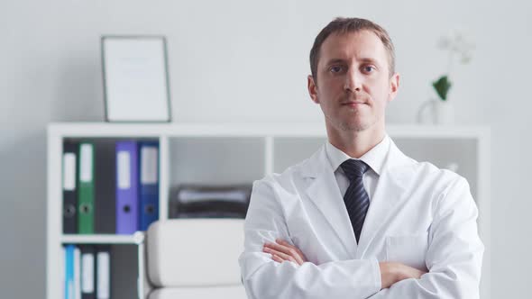 Professional medical doctor working in hospital office using computer technology.