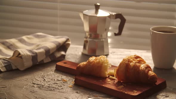 Food and Drink Concept. Morning Breakfast - Coffee and Croissant on a Table