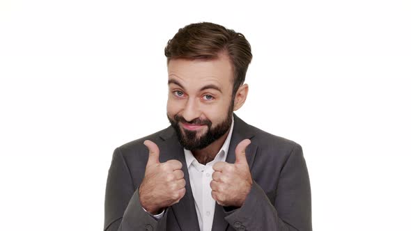 Headshot of Joyful Male Office Worker Gesturing with Fingers Up Meaning Approval Celebrating His