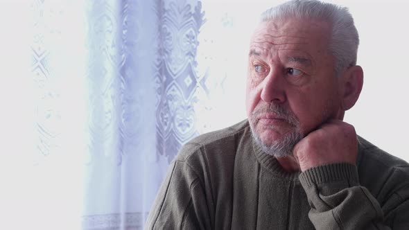 Worried Thoughtful Senior Old Adult 80s Man Sit Alone at Home