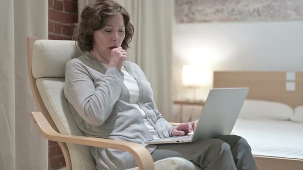 Sick Old Woman Coughing on Sofa