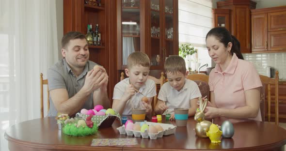 Easter Painting  Family with Two Boys Coloring Easter Eggs