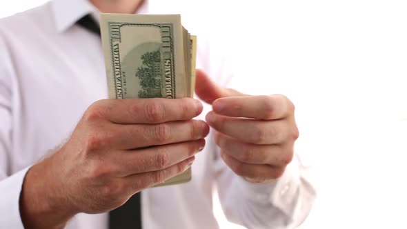 A Man In A White Shirt And Tie Scatters Money, Dollars. Shows Money. Businessman Made A Lot Of Money