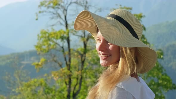 Summer Portrait of a Cheerful Young Blonde