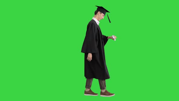 Graduate Student Walking and Smiling on a Green Screen, Chroma Key.