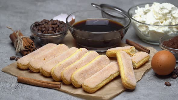 Ingredients for Traditional Tiramisu Cake on Concrete Background