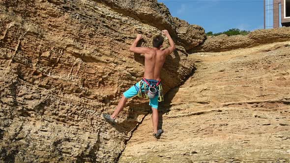 Climber Climbs On A Mountain