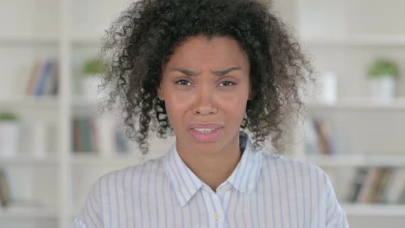 Sad African Woman Crying at Camera