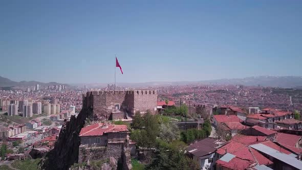 Ancient Ankara fortress with Turkish flag. Aerial view.