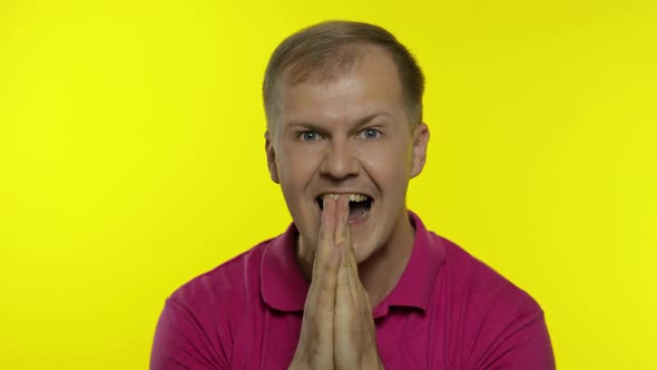 Portrait of Young Caucasian Man Posing in Pink T-shirt. Satisfied Handsome Guy Celebrates, Wins