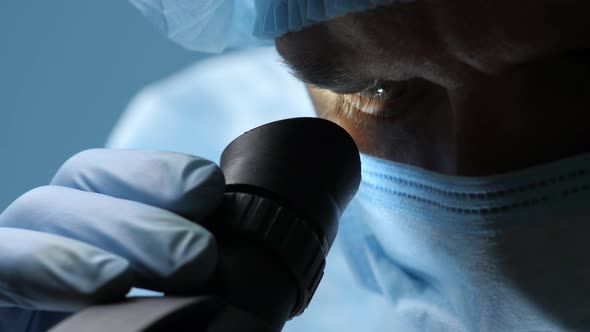 Search Vaccines, Drugs for Coronavirus Disease. Laboratory Worker Wearing Protective Mask and Gloves