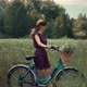 Girl In Sunglasses And Dress. Woman In Hat Enjoying Weekend. Woman Cyclist Walking With Bike. - VideoHive Item for Sale