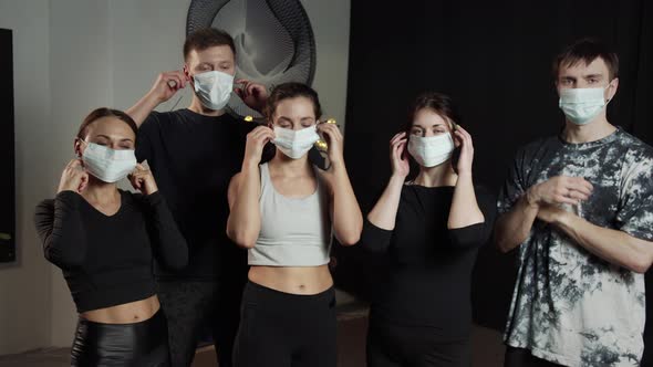 Group of Sporty People are Taking Off Face Masks and Throwing It Away