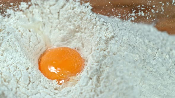 Super Slow Motion Shot of Falling Egg Into Flour at 1000Fps.