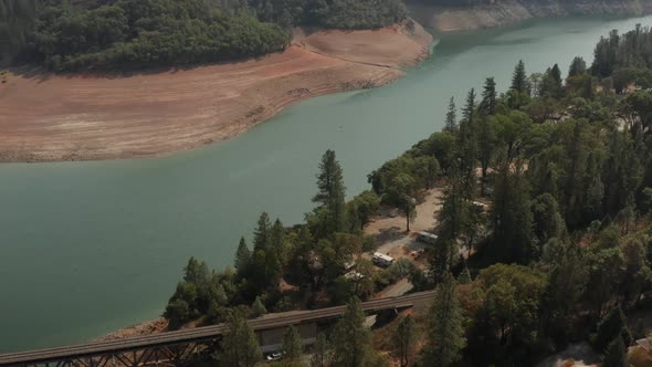 Aerial view of Shasta Lake Bridge in Northern California low water levels during drought