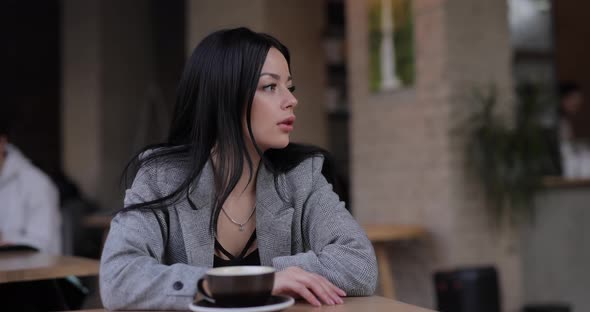 Woman Waiting Her Friend in Cafe