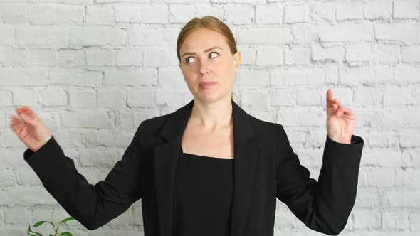 A business woman making bored blah blah gestures with her talking hands