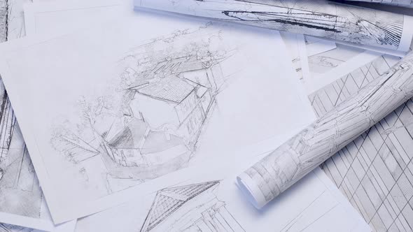 Background with architectural drawings. Sheets with sketches of buildings.