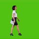 Stylish Happy Businesswoman Walking and Smiling Over a Green Screen in A Full Side Shot - VideoHive Item for Sale