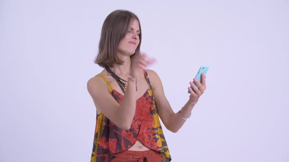 Stressed Young Hipster Woman Using Phone and Getting Bad News