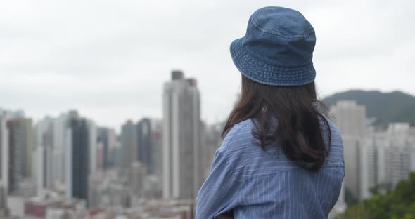 Woman look at the city with crowded of the building