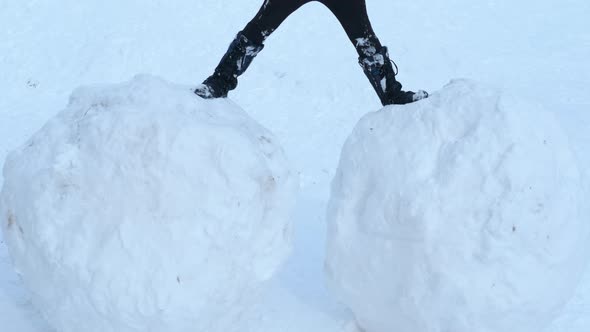 Child on Big Snowball