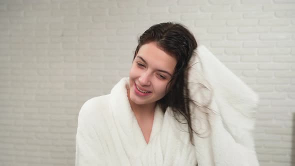 Girl Drying Wet Hair with Towel