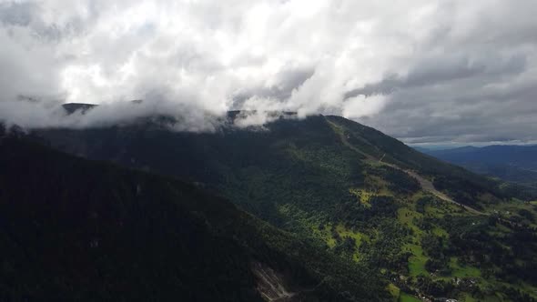 Heavy Clouds Over Mountain Peaks, Aerial View