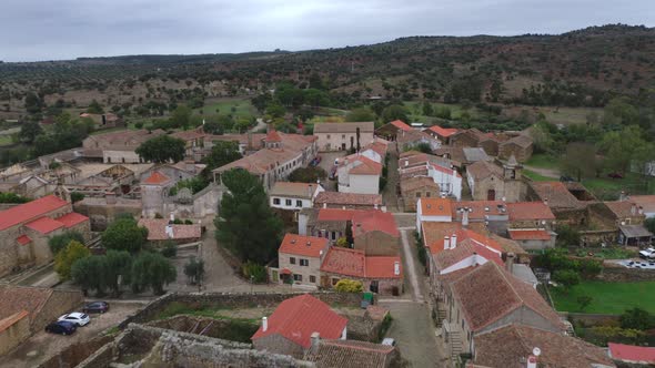 Drone aerial view of Idanha a velha historic village and landscape with Monsanto on the background,