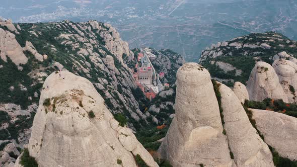 Aerial Drone Shot of Multi Peaked Mountain Montserrat with Santa Maria De Montserrat Monastery in