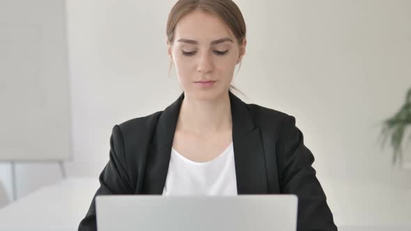 Close Up of Young Businesswoman Typing on Laptop