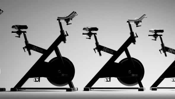 Fitness Bicycles or spinning bikes in the modern gym. Cardio, health, loopable.