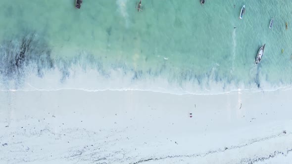 Vertical Video Boats in the Ocean Near the Coast of Zanzibar Tanzania Aerial View