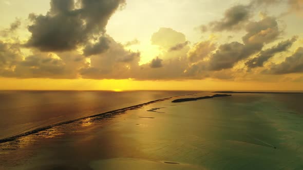 Aerial drone view sky of beautiful coast beach wildlife by blue ocean and bright sandy background of