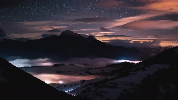 Magic Night Sky Stars Motion in Winter Alps Mountains in Foggy Valley Nature Astronomy