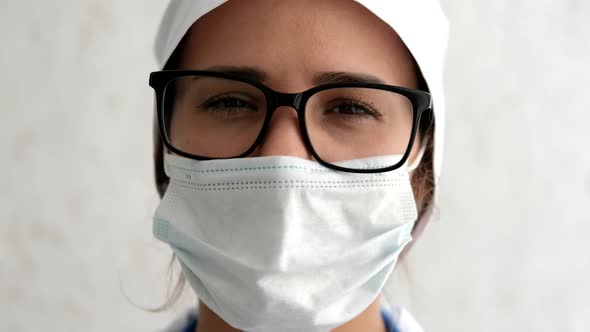 A Nurse with a Mask During a Coronavirus Pandemic. Close in Slow Motion.