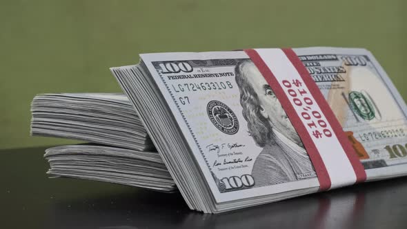 Dollars Bundles Rotate on Green Background Heap of Money