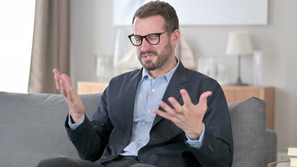 Disappointed Young Businessman Feeling Worried at Home 