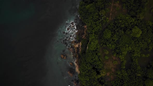 Beautiful Bingin beach with exotic cliffs houses and hotel located in Bali, Indonesia. This drone fo