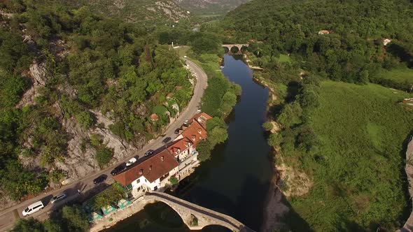 Drone View of the Crnojevica River Stone Bridges and the Road on the Bank