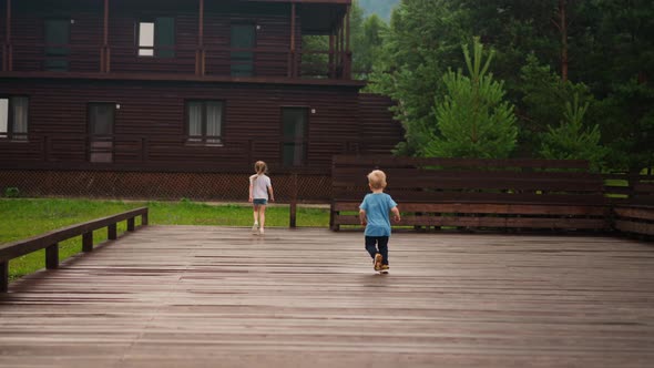 Toddler Boy Runs Follows Elder Sister Jumping Down From Deck