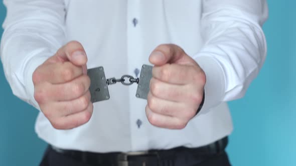 The Convict in Handcuffs Shows a Gesture of Approval with the Court Decision