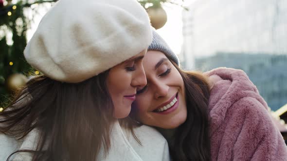 Video of  two women embracing on Christmas time. Shot with RED helium camera in 8K.  