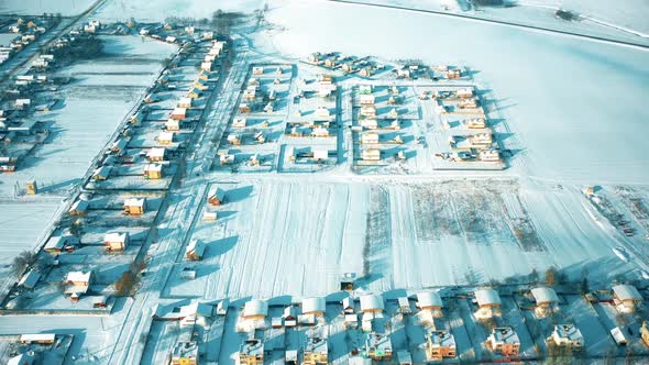 Countryside Road And Village Snowcovered Gardens And Field In Winter Day