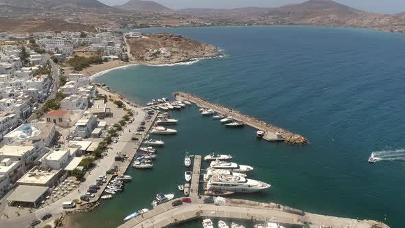 Aerial view of harbor at Naousa city, with traditional white houses, Greece.