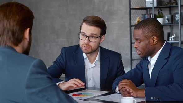 Young leader with a business team at a meeting in workplace. Meeting